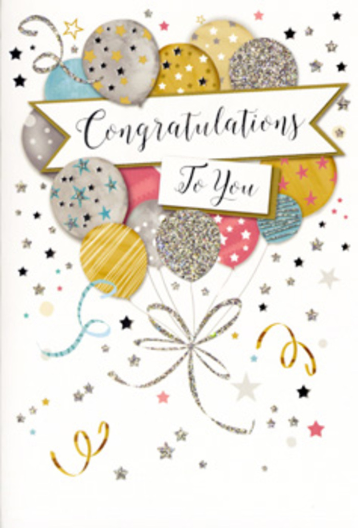In this photograph, a single congratulations card is positioned upright, its design full of gentle movement and quiet glamour, as if ready to accompany a hand-tied bouquet delivered across Petts Wood. The central artwork features an airy cluster of balloons that seem to float just above the card's surface, each one carefully shaded to give a sense of softness and roundness. The colours range from warm gold and champagne to cool silver, powder blue, rose pink, and muted grey, arranged so that no two identical tones touch, echoing a well-balanced floral arrangement. Delicate patterns decorate the balloons: some are dusted with tiny stars, others with slim stripes or a mist of glitter-like dots, all rendered in metallic inks that catch imaginary light like reflections in the windows along Tudor Way. Slender curling ribbons trail from the base of the balloon bouquet, drawn in metallic silver and gold that twist around one another in relaxed spirals, giving the impression of weightless movement. Around the balloons, a scattering of small stars, curling swirls, and confetti flecks dance across the pale, lightly textured background, evoking the sparkle of a small celebration at home with family and friends. Cutting across the middle of the composition is a soft, gently arched banner, edged with a hint of shimmer. On this banner, Congratulations To You is written in elegant calligraphy, the flowing script adding a note of refinement and sincerity. The overall feeling is sophisticated yet joyful-a timeless design suited to graduations, promotions, new homes, or any treasured achievement you might want to mark with flowers and a card, thoughtfully chosen from a trusted Petts Wood florist.