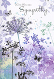This sympathy card reads like a gentle visual poem inspired by the calm corners of Petts Wood. Across the front, airy silhouettes of wild, umbelliferous flowers rise from a soft wash of colour, their stems as fine as drawn threads and their heads formed from clusters of tiny dots and lines. The palette is restrained yet comforting: layers of lavender, soft indigo, and muted blue mingle with hints of silvery green, recalling late evening light sliding over the woodland edges near Towncourt Lane. The blooms appear semi-transparent, their tips dissolving into the background so that they seem to float between earth and sky. Scattered among them, a couple of ethereal butterflies hover with scarcely defined wings, like fleeting glimpses of hope or the sense of a loved one close by. The background itself is a dreamy blend of watercolour, clouded and blurred, with no hard outlines, suggesting mist or distant trees softly out of focus. Everything about the composition whispers calm: the vertical lift of the stems, the gentle spacing between each flower, the cool yet soothing tones. The phrase With Sincere Sympathy is written in an elegant script above or beside the flowers, its flowing letters echoing the natural curves of the stems. As a florist serving the Petts Wood community, I can feel how this design cradles grief with respect-understated, never showy-making it an ideal companion to a thoughtful condolence arrangement delivered to a local family, chapel, or quiet home where gentle beauty is especially welcome.